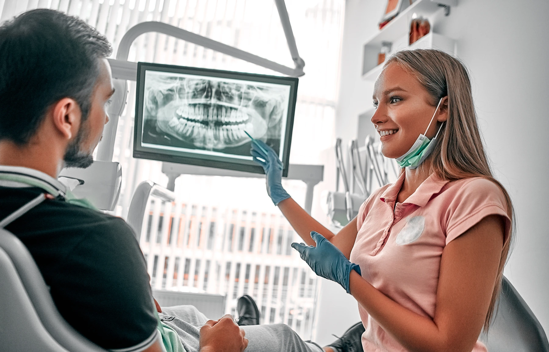 Dentist discussing with a patient about xrays